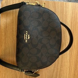 Brown and black signature coach crossbody